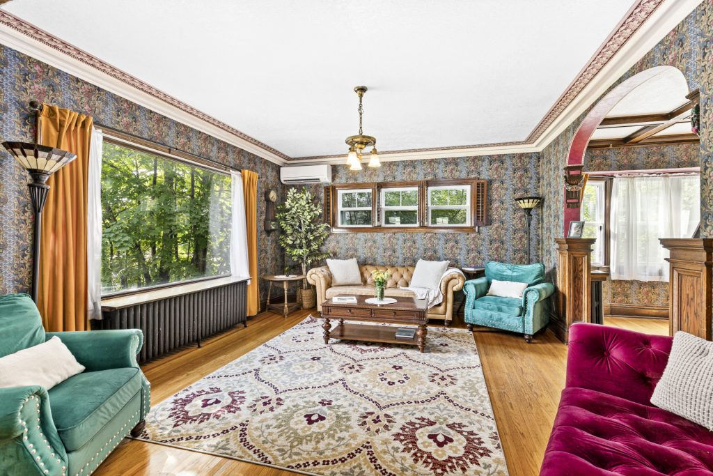 Original woodwork and hardwood floors run through the main floor.