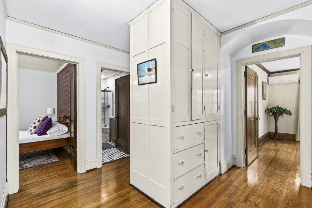 Built-in linen cupboards in the hallway, original to the house.