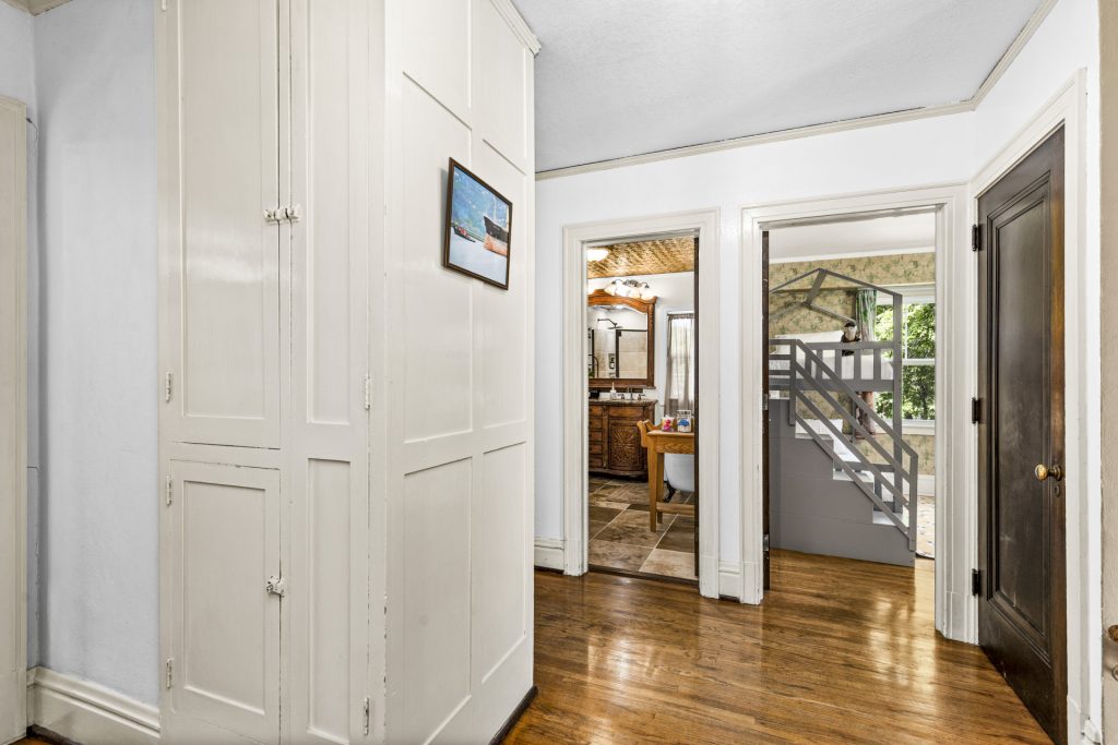 Built-in linen cupboards in the hallway, original to the house.