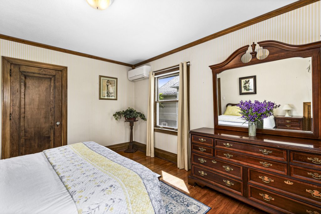 Solid wood dresser with a mirror and plenty of storage.