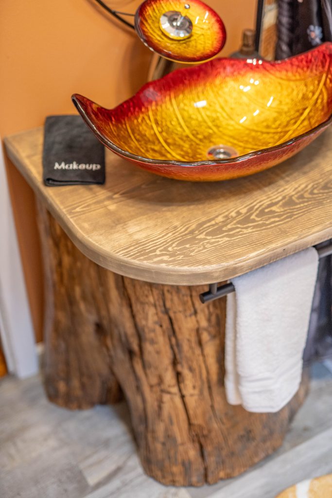 Our bathroom vanity is made from a locally-sourced tree trunk!