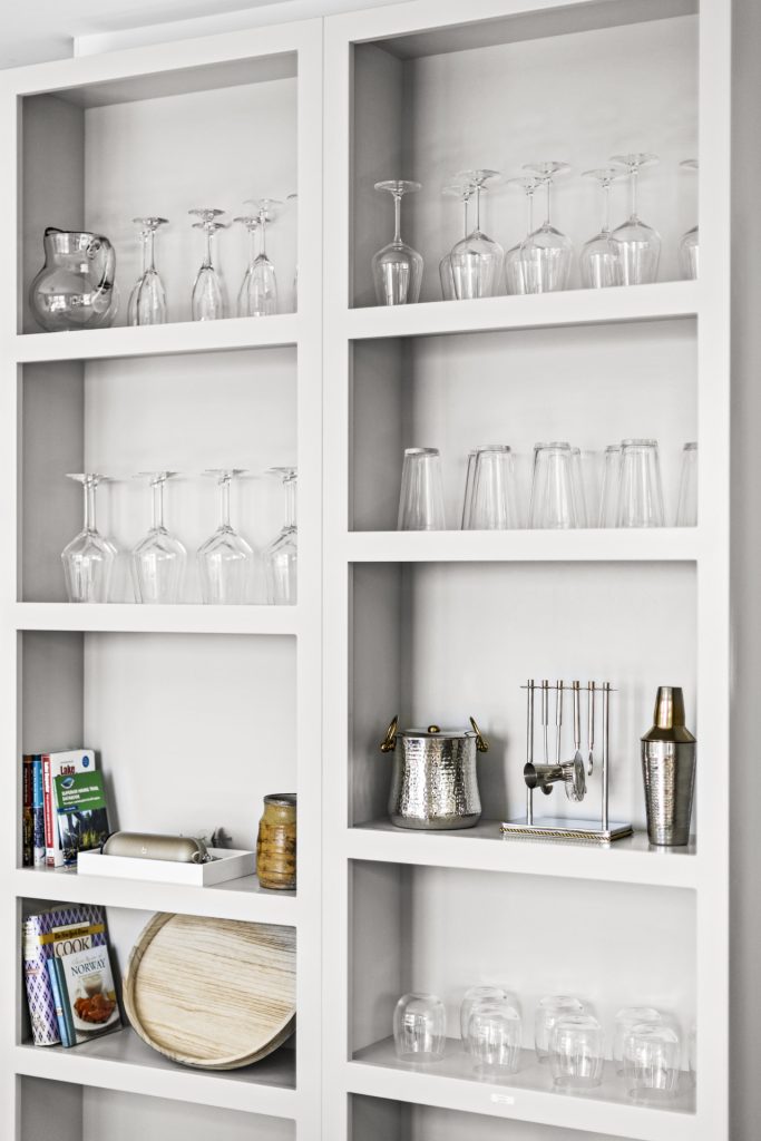 Wine glasses, stemware, and bar essentials are stocked and ready for evening toasts.