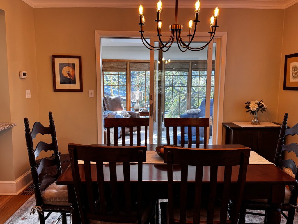 Dining room with the sunroom in the background.