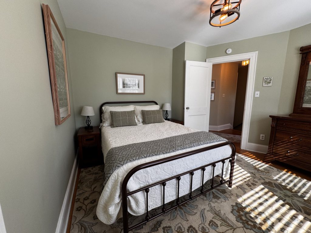 Garden Bedroom on second floor. Window overlooking backyard/garden.