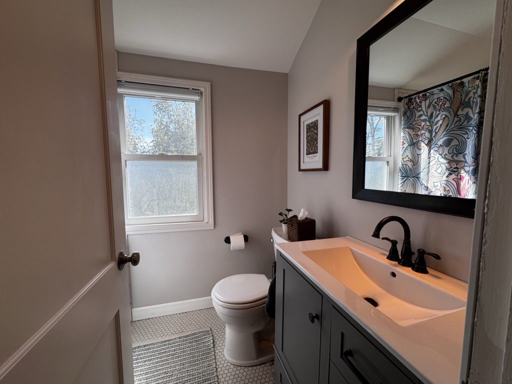 Upstair full bathroom with shower and tub combo.