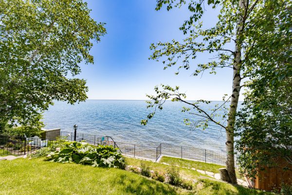 Sprawling green space meets the big lake, offering room to roam with the water always in view.