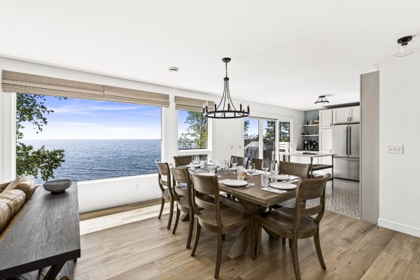Dine in style at the spacious table, where floor to ceiling windows put Lake Superior on full display.