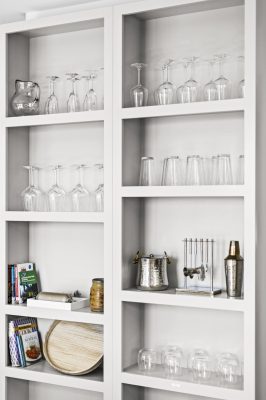 Wine glasses, stemware, and bar essentials are stocked and ready for evening toasts.