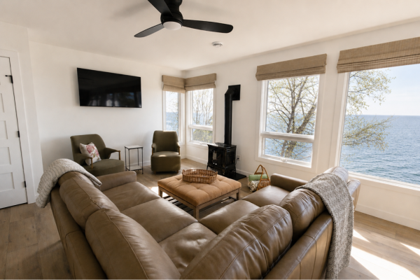 Relax in the lakeside living room with panoramic Lake Superior views.