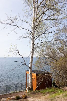 Private electric sauna with floor-to-ceiling windows overlooking Lake Superior.