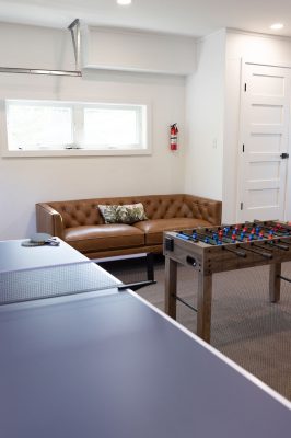 Garage game room featuring basketball, ping pong, foosball and family fun.