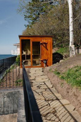 Private electric sauna with floor-to-ceiling windows overlooking Lake Superior.