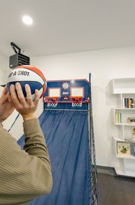 Garage game room featuring basketball, ping pong, foosball and family fun.