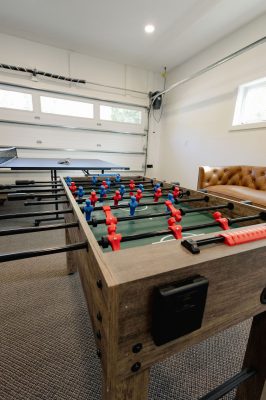 Garage game room featuring basketball, ping pong, foosball and family fun.