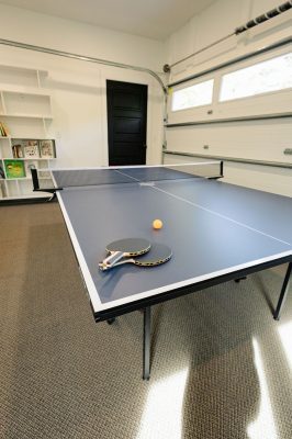Garage game room featuring basketball, ping pong, foosball and family fun.